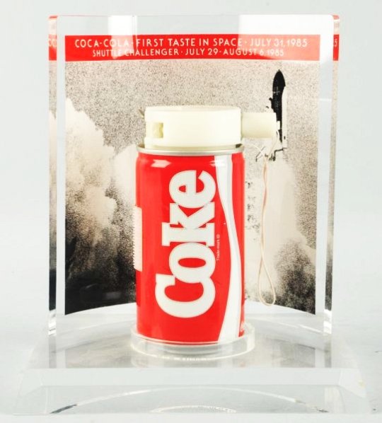 1985 Coca-Cola Space Can and Display.: The same style of can and apparatus that went to outer space on the shuttle Challenger in 1985 is represented here with a nice plexi stand. Only a few scratches on base bottom and numerous small dents