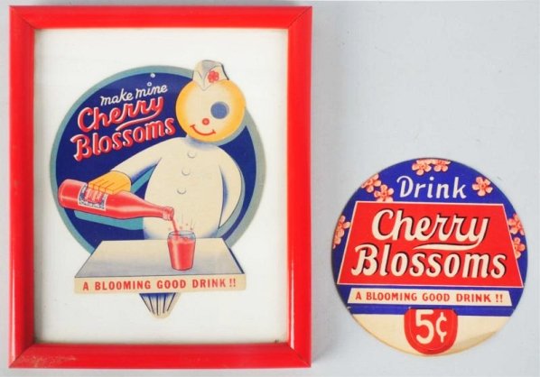 Lot of 2: Cherry Blossom Bottle Toppers.: 30s-40s with the support tab missing on one and bent on the other. Clean otherwise. Condition (Excellent Plus). Size Largest Framed: 11" x 8 - 3/4".