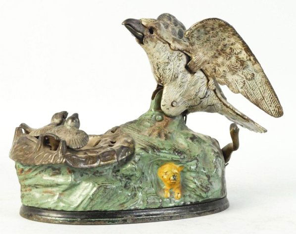 Cast Iron Eagle & Eaglettes Mechanical Bank.: J. & E. Stevens, missing eyes, bellows. Working. Condition (Good - Very Good). Size 8" L.
