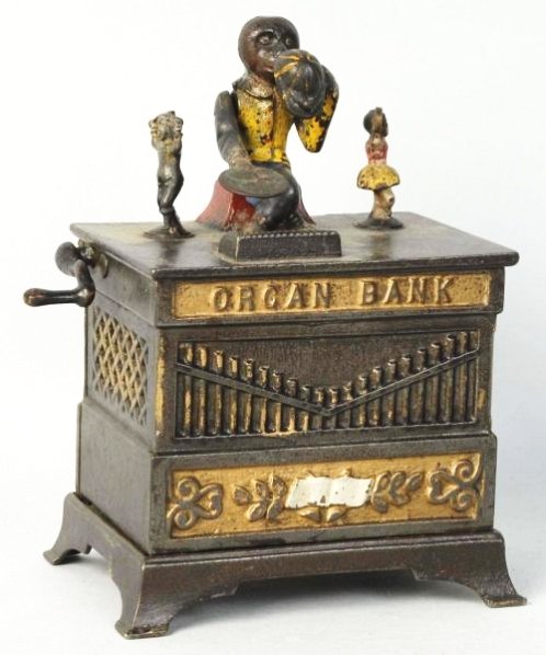 Cast Iron Organ Grinder Mechanical Bank.: Kyser rex, replaced trap, replaced crank, reattached right arm front panel does not black light the same as the rest of the bank. Condition (Good). Size 7 - 1/2" T.