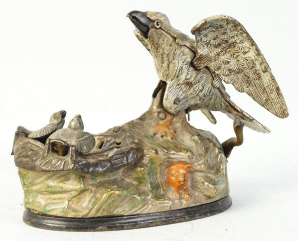 Cast Iron Eagle & Eaglettes Mechanical Bank.: J. & E. Stevens, bellows working, right wing hangs lower. Condition (Very Good Plus). Size 8 - 1/4" L.