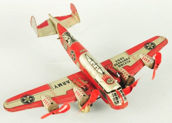 Marx Tin Litho Wind-up Flying Fortress Army Plane: Marked No.2095 four cellular propellers as props in front. Also marked TWA on back of tail fin. Two mounted guns. Some oxidation to caps underneath props and some general overall scratching and wear.