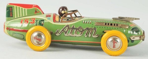 Japanese Tin Litho Friction Atom Race Car Toy.: Original driver head and sports caps. Marked Atom on both sides and behind drivers head. Also the No.153 on both sides of rear below tail fin. Some general paint loss and wear to wheels. Other wheel p