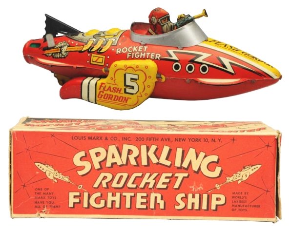 Tin Litho Wind-up Flash Gordon Rocket Fighter: Working but needs flint. Original box. Toy has some scuffing to the top of the astronauts head. Box has several tear repairs throughout. Flaps have been reattached on one end. Toy (Very Good). Box (Ve