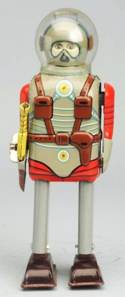 Tin Litho Wind-Up Space Commando.: Made in Japan by Nomura. Working. Has box. Wheels on bottom of the feet have flattened and dome has a one and half in crack in back. Toy ( Excellent). Size 7 - 3/4" T.