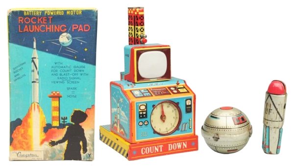 Tin Litho Battery Op. Countdown Rocket Launch Pad: Made in Japan by Yonezawa. Has box. Toy has some scratching on the inside bottom of the toy a small crease in the tin base. The knob to the firing switch is rubber thats deteriorated to some degree an