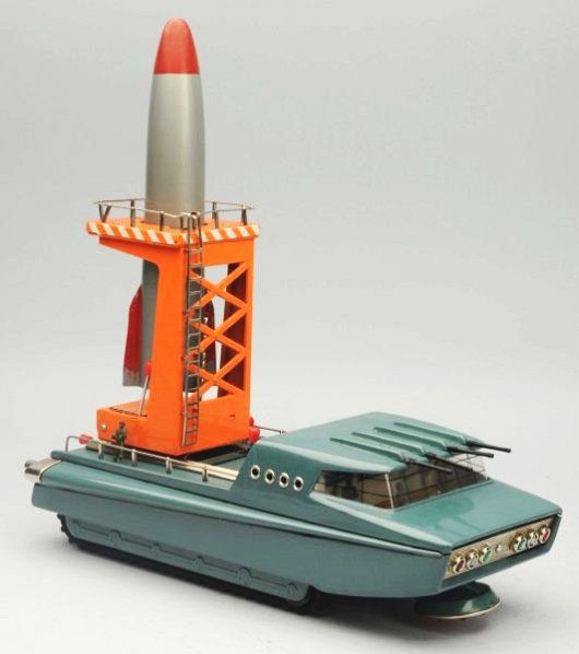 Tin Litho & Painted Battery Op. Moon Mobile.: Moon Mobile Rocket Launcher. Made in Japan. Sears Exclusive Toy. Working. Has box. Some paint loss on the rockets fins. One of the men is loose from the base. Box has some tears on each corner and som