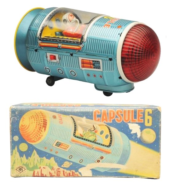 Tin Litho Battery Op. Capsule 6.: Made in Japan by Masudaya. Working. Has box. Toy has some light crazing. Box has some paper lifted in two areas on the top panel and a small area on one side panel somewhat faded. Toy (Near Mint). Box