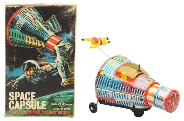Tin Litho Battery Op. Space Capsule.: Made in Japan by Horikawa. Working. Has box. Has some sauder on inside of battery door and some residue on the window of the vehicle . Box has some creasing throughout. Toy (Very Good - Excellent). Bo