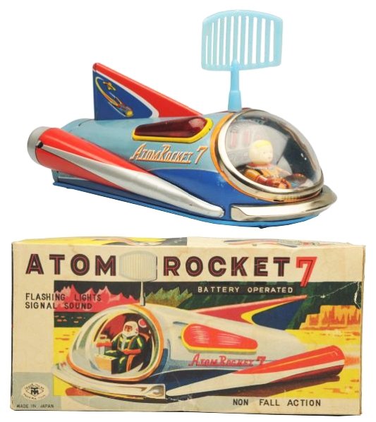 Tin Litho Battery Op. Atom Rocket No.7.: Made in Japan by Masudaya. Toy has some oxidation on the back of the battery door and also on one of the lens grommets. Box has some tear repairs and some staining throughout the box. Toy (Very Good).