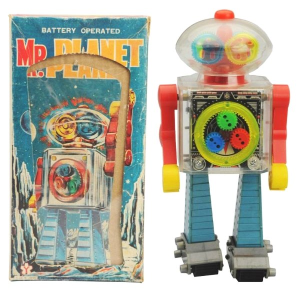 Plastic Battery Op. Mr. Planet Robot.: Made in Japan by Yonezawa. Working. Has box. Toy has some very light scratches to the chest. Box has some discoloration throughout. Toy (Excellent). Box (Excellent). Size 8 - 3/4" T.