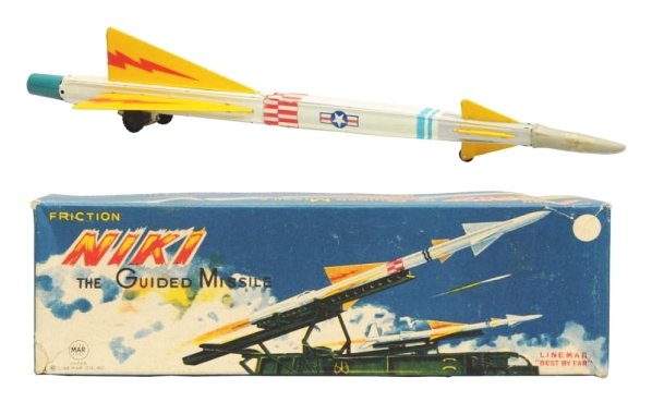 Tin Litho & Friction Niki Rocket.: Made in Japan by Linemar. Working. Has box. Rubbe tip is in two pieces and taped together and one of the wheels has a split in it. Box has some tear repairs to the corners. Toy (Very Good - Excellent)