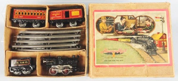 American Flyer O-Gauge Clockwork Passenger Train.: Set. Includes original box with nice color label. Is a clockwork O-gauge American style engine with cast iron frame marked A.F. 10 which is embossed on both sides of cab. Matching No.120 four wheel te