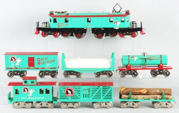 Lot of 7: Piece McCoy Train Set with Boxes.: McCoy E2 Cast locomotive in great Northern colors. Complete. Great Northern Reefer, Great Northern Caboose, Cattle car, Tank Car, Flat car with logs, and a great bulk head flat car. All have original 