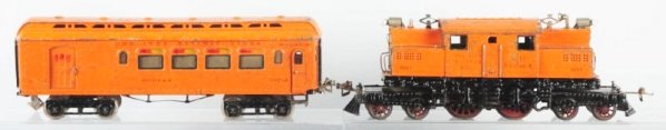Ives No.3243 Engine & Car.: Standard gauge. Electric style engine and one car. Pre-war. No.3243 New York Central Engine. One No.187-3 Buffet car. Both have moderate to heavy paint flaking on roofs. Roofs also have some denting. 