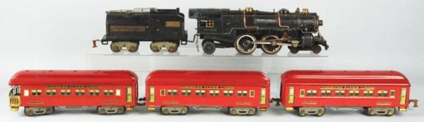 No.1446 Iron Monarch Passenger Train Set.: American Flyer. Wide gauge. Includes original individual boxes for engine tender and three passenger cars and set box. Set box does show some tearing and wear. Includes a No.4692 steam type locomotive