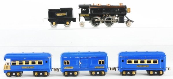 American Flyer O-Gauge Passenger Train Set.: Pre-war. Includes steam type engine with copper trim matching American Flyer four wheel tender and three passenger cars. Tender has one spot above decal on left side. Cars do have some chipping and we