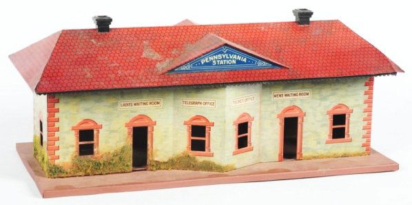 German Bing 1Gauge Train Station.: Marked Pennsylvania Station underneath roof awning. Nice lithography. Some pitting and litho loss to one side of roof and looks like base has been repainted. Condition (Very Good).