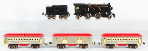 Lionel No.262 O -Gauge Passenger Train Set.: Pre-war. Includes Engine No. 262 steam type. Engine has original individual box. Matching Lionel Lions No.262T tender and three passenger cars in grey and red. Cars also have partial individual boxes 