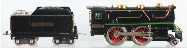 Lionel No. 384 Engine & Tender.: Standard gauge. Steam type engine No.384 with matching No.384-T Lionel lines tender with green striping. Minor wear to front cow catcher area. Condition (Excellent).