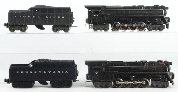 Lot of 2: Lionel Engines with Tenders.: Lionel No.671 steam locomotive with smoke hole unit. Complete and all original. No.2671W PRR whistle tender. No.671RR steam locomotive missing rear steps scratches and paint chips. No.2046W tender fra