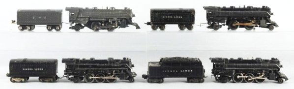 Lot of 4: Lionel Engines with Tenders.: No.1164E grey steam locomotive. Missing front truck. Has some scratches and paint chips. No.1689W grey whistle tender with scratches and paint chips. No.1664 steam locomotive scratches and paint chips