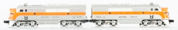 Lot of 2: Lionel Western Pacific Engines.: No.2345 Power unit is complete. Has some flaking on the nose decal, some scratches and paint chips. Dummy unit clean battery box. Has original boxes with inserts. Condition (Very Good).