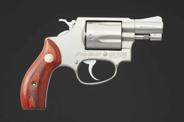 Smith & Wesson .38 cal. Ladysmith Revolver**.: Smith & Wesson Model 36 .38 Special S&W Ladysmith marked in fine condition with flat nickel finish, rosewood grips, fluted cylinder, and side button release. Comes with factory case, cleaning kit, and