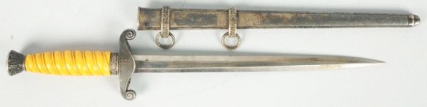 German Army Dagger.: German Army Nazi era officers dagger in very good condition. Marked Alcoso Solingen on the blade, yellow grips with good engraving detail and correct metal double ring scabbard. Nice example of Heer o