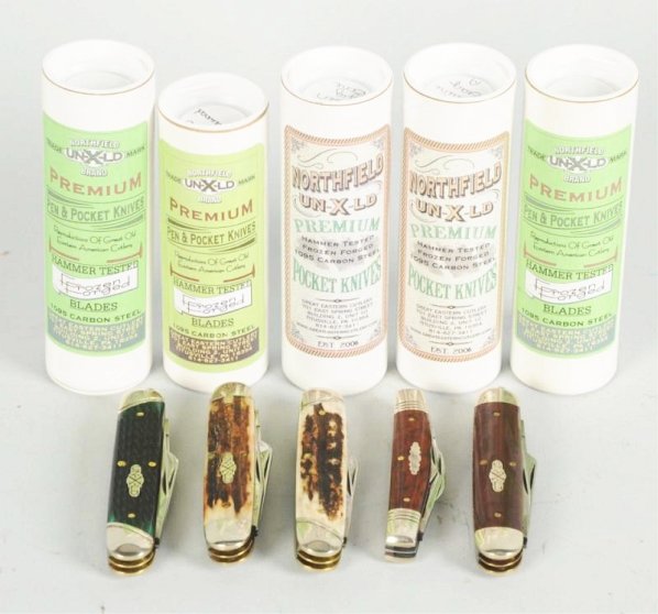 Lot of 5: Northfield Un-X-LD Knives.: Made in U.S.A. Five contemporary folding knives and one advertising lapel pin. Includes a 3 5/8" 4-blade congress pen knife handled in snake wood, includes two 4 1/8" 3-blade cattleman handled in genu