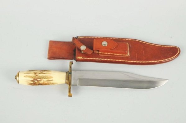 Randall Sportsman Knife Orlando, Florida.: Model No.12 "Sportsman" 9" fixed blade knife. Contemporary Bowie with a saber ground clip point blade. Handle is genuine stag fitted with a brass C Guard and faney brass end cap. Knife is in correct s