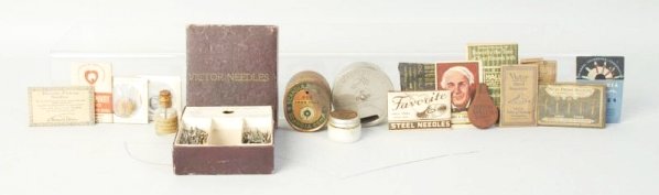 Lot of Phonograph Accessories.: Victor needle, his master voice needle holder, Edison Grease, and ten needle holders. Condition (Excellent). Size Largest: 4 - 1/2" L.