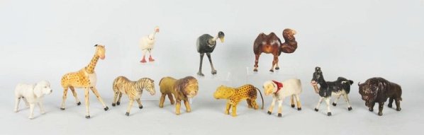 Lot of 11: Schoenhut Animals.: Circus animals. All with one wire cage, camel general wear, ostrich minor wear, goose minor wear, white poodle minor wear, hyena minor wear, lamb minor wear, buffalo minor wear, giraffe minor wear, li