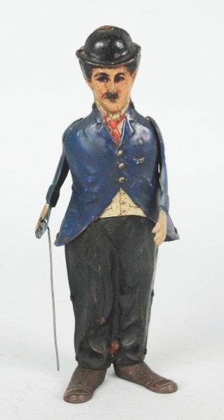 B&R Charlie Chaplain Lead Foot Tin Wind-up Toy.: Toy has replacement arms and cane. Has some soiling and scratching throughout. Condition (Good). Size 8" T.