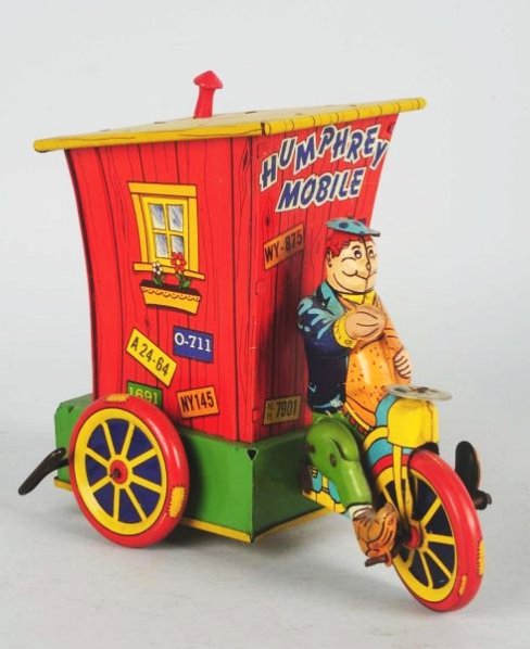 Wyandotte Tin Wind-up Humphrey Mobile.: Toy has replacement plastic stack. Some scratching and wear throughout. Condition (Very Good). Size 7" T.