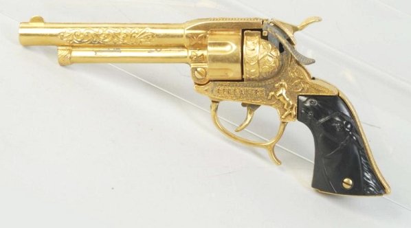 Gene Autry Refinished Gold Cap Gun.: Gold refinish poorly done and many missing spots of gold. Condition (Good - Very Good). Size 9 - 3/4" L.