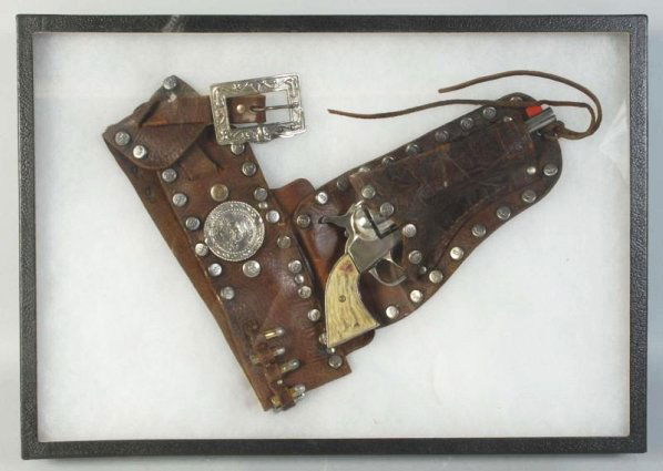 Roy Rogers Cast Iron Gun in Holster.: Gun is heavily polished, works great. Nice grips, some warping. Holster (Fair - Good). Condition (Very Good). Size 10 - 1/2" L.