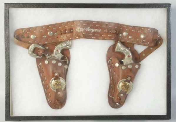 Roy Rogers Holster with Sure Shot Guns.: Guns are Hubley Sure Shots. Condition (Very Good). Size Each: 8" L.