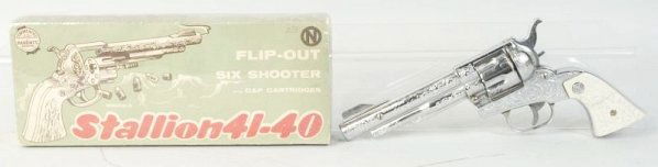 Nichols Stallion 41-40 Cap Gun.: Has six bullets. Revolves well. Box is shrink wrapped. Gun (Near Mint - Mint). Box (Very Good Plus). Size Largest: 11 - 1/4" L.