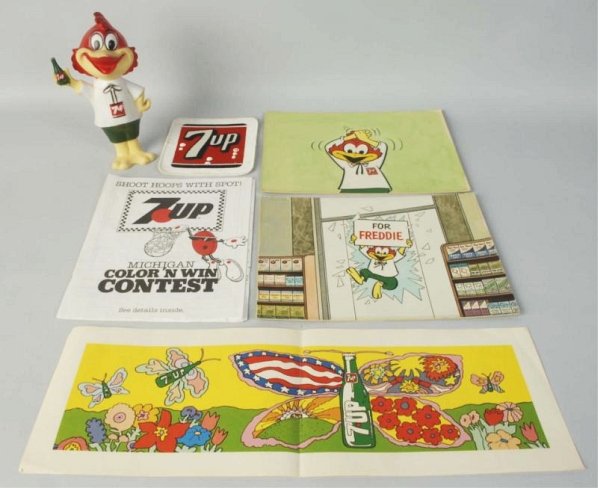 Lot of 7Up Advertising.: Rubber band doll holding 7up bottle "Freshen up Freddie". Freddie die cuts. Condition (Excellent). Size Largest: 12" x 9".