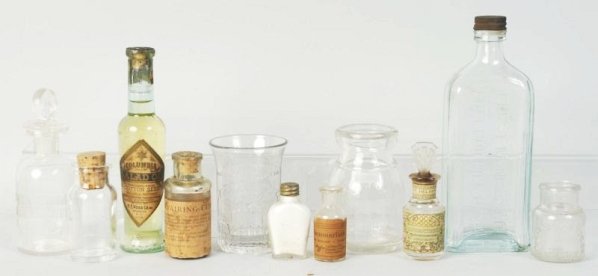 Lot of Small Glass Advertising Bottles.: Includes a selection of mostly medical bottles. Also is a small Bordens Milk bottle and a Moxie drinking glass. Condition (Excellent). Size Largest: 8 - 1/4" T.