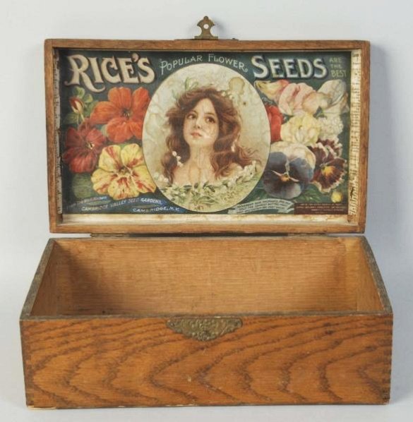Rices Seeds Wooden Advertising Box.: This box has a very attractive interior lid label. Showing a beautiful girl with flowers. Condition (Very Good). Size 11" L.