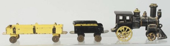 Early Cast Iron American Made Floor Train.: Has an unusual configuration of engine. American style with cow catcher. Has pressed steel tender and dump car. Dump car could be a possible old repaint. Some paint loss and wear to the front wheels o