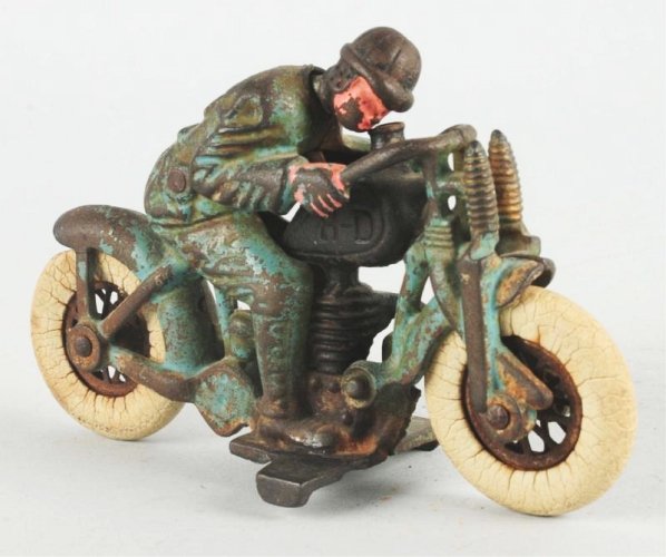 Cast Iron Hubley Harley Davidson Hill Climber.: Motorcycle has white rubber tires. Marked "H-D" on gas tank. Head turner. Moderate amount of paint loss and wear overall. Condition (Very Good). Size 6 - 1/2" L.