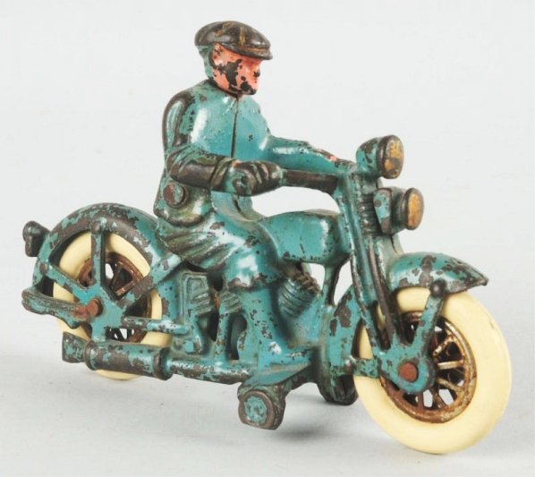 Cast Iron Hubley Harley Davidson Motorcycle Toy.: Has replacement rubber tires. Marked "Harley Davidson" on gas tank. Some overall paint loss and wear. Condition (Very Good). Size 6 - 1/4" L.