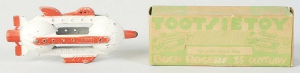 Diecast Buck Rogers Tootsietoy Attack Ship.: Includes original box. Box is complete and marked "No. 1033 Attack Ship". Ship has an even amount of chipping and wear. Condition (Very Good). Size 4 - 1/2" L.