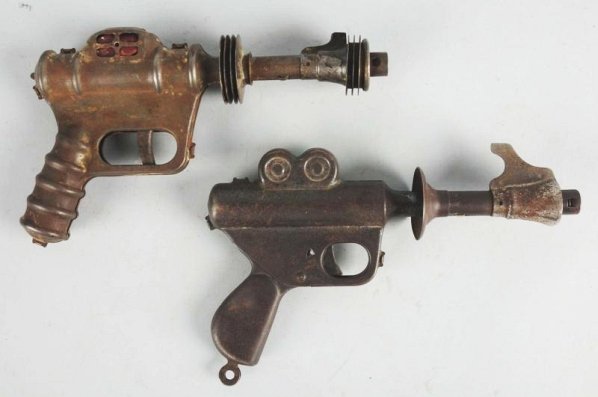Lot of 2: Buck Rogers Space Pistols.: Different models. One is marked "Buck Rogers". Both original and working, but show medium to heavy wear. Condition (Good - Very Good). Size Each: 10" L.
