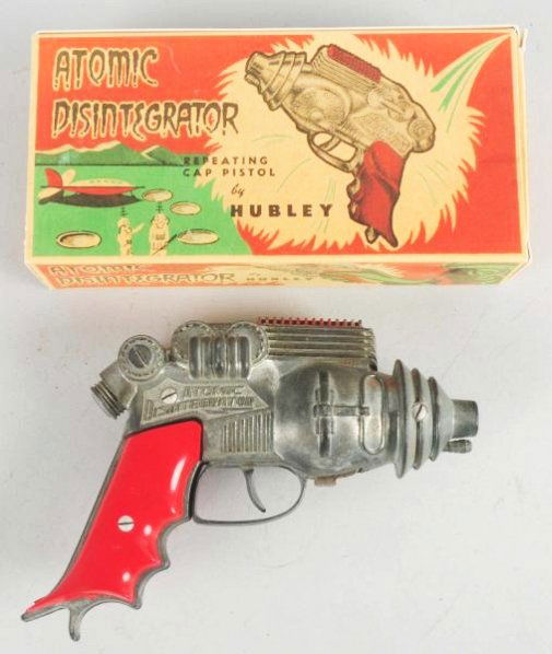 Hubley Diecast Atomic Disintegrator Gun.: Comes with laser copied box. Plastic grips are good. Gun does have some use and oxidation. Condition (Very Good). Size 8" L.