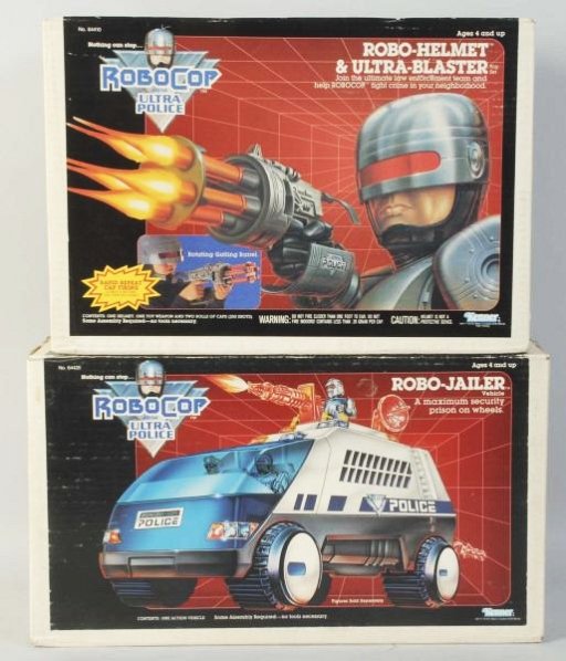 Lot of 2: RoboCop Ultra Police Accessories.: One is a Robo-Jailer vehicle and the other is a Robo-helmet & Ultra-blaster toy set. Both are sealed in original box. Made by Kenner. Some wear to boxes. Condition (Excellent). Size Largest: 17 - 3/4"