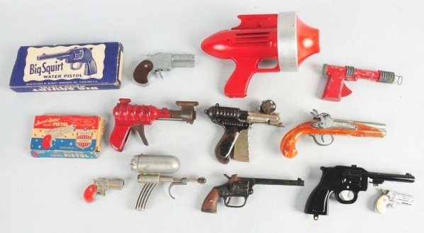 Lot of 11 Misc. Toy Guns.: Includes Secret Agent Hideaway pistol in the original box, a big squirt water pistol in the original box, and several space guns including one wyandotte and one hiller atomic ray gun and others. Condi
